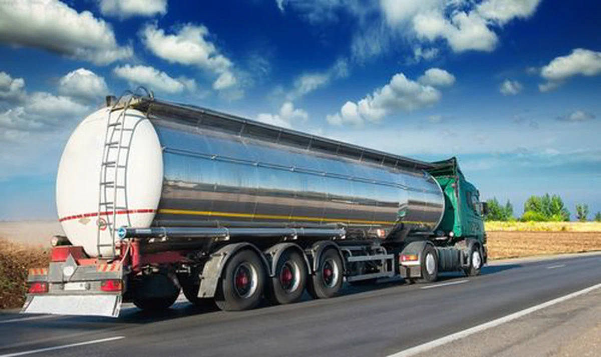 A truck hauling freight on a trailer.
